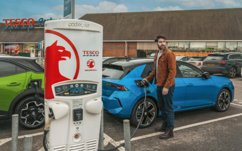 Man charging Vauxhall in Tesco car park
